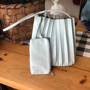 Blue vegan leather handbag w/small attachable zippered clutch.